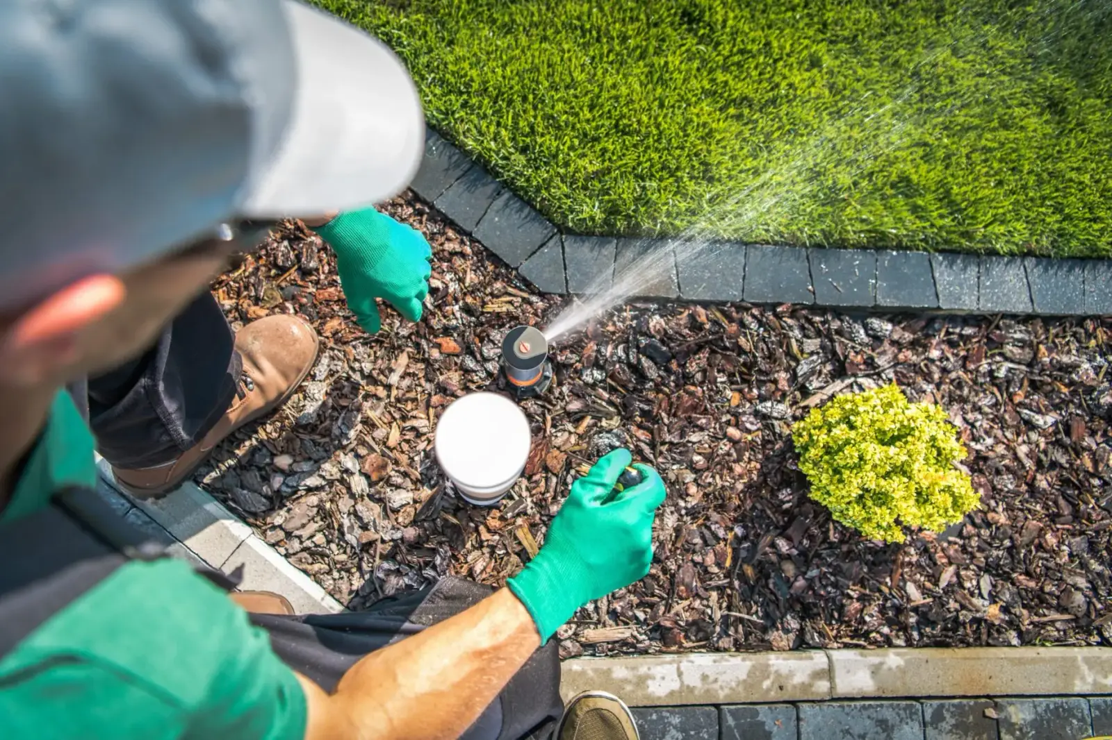 Rocket Turf technician repairing a residential irrigation system